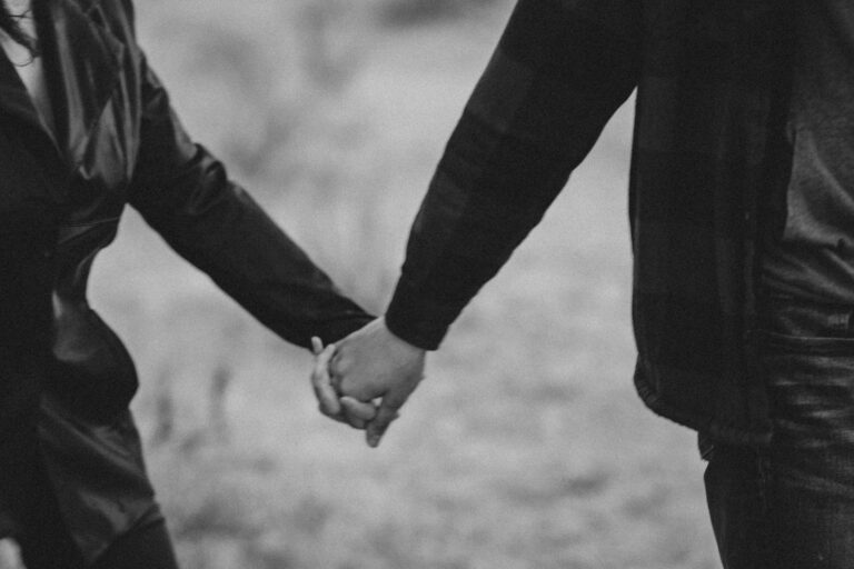 Couple holding hands